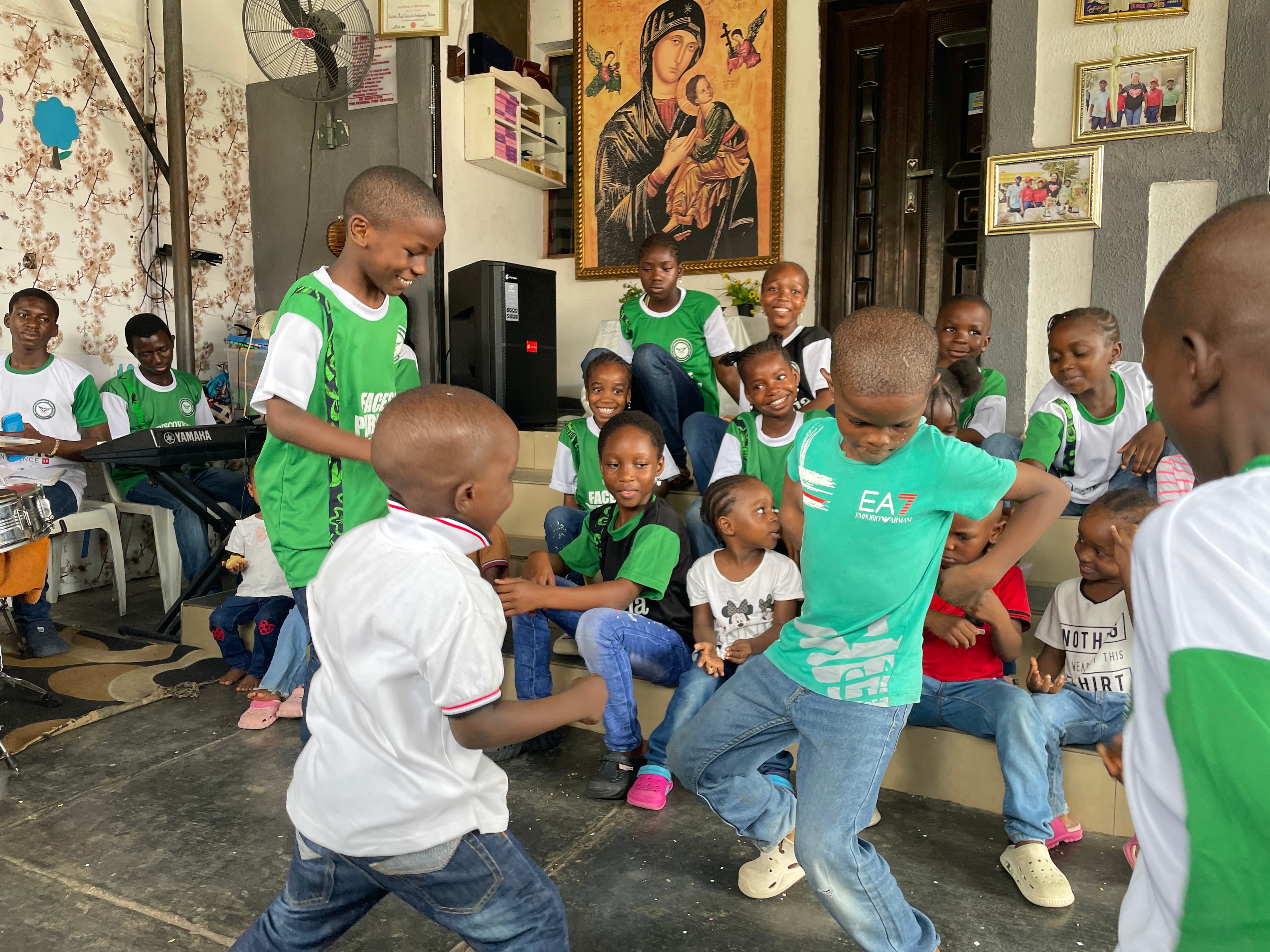 Mercy Wellness team members and children gathered together at Gifted and Talented Orphanage